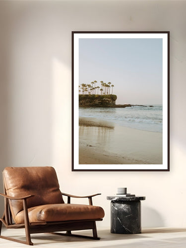 Crescent Bay by Bree Banning from Laguna Beach, CA - framed black frame fine art photography displayed in a reading nook setting