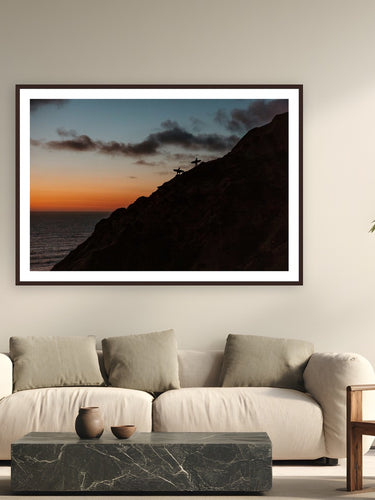Surfers Climb by Bree Banning from San Diego, California - framed black frame fine art photography displayed in a modern living room setting