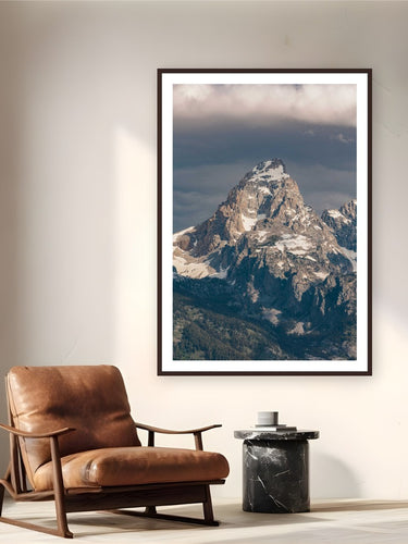 The Grand by Bree Banning from Grand Teton National Park, Wyoming - framed black frame fine art photography displayed in a reading nook setting