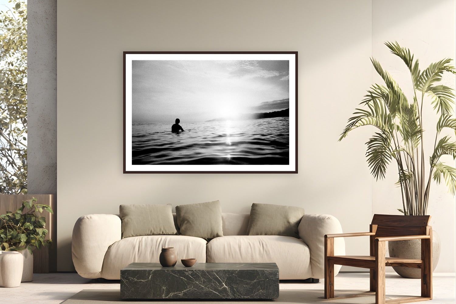 Lonely Surfer by Devon Cardamone from La Bocana, El Salvador - framed black frame fine art photography displayed in a modern living room setting