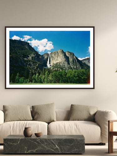 Yosemite Falls by Evan Ruderman from Yosemite National Park - framed black frame fine art photography displayed in a modern living room setting