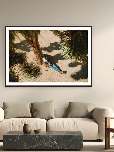 Cowboy Nap by Ryan Valasek from Joshua Tree, California - framed black frame fine art photography displayed in a modern living room setting