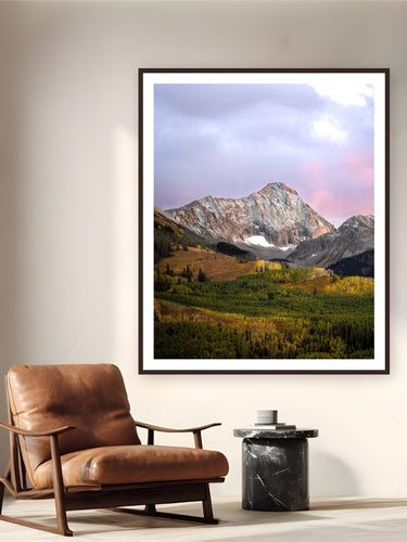 Capitol Peak by Sam Ferguson from Aspen, Colorado - framed black frame fine art photography displayed in a reading nook setting