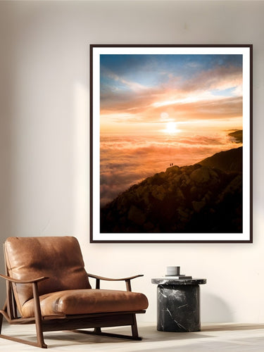 Above The Clouds by Arthur Girard from Arlington Peak, California - framed black frame fine art photography displayed in a reading nook setting