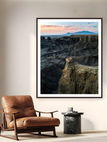 Moonscape by Arthur Girard from Caineville, Utah - framed black frame fine art photography displayed in a reading nook setting