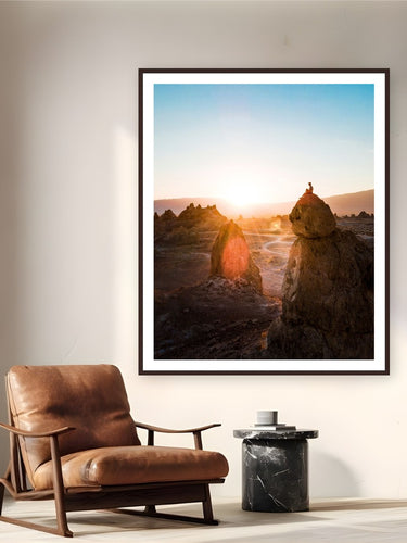 Trona Sunrise by Arthur Girard from Trona Pinnacles, California - framed black frame fine art photography displayed in a reading nook setting