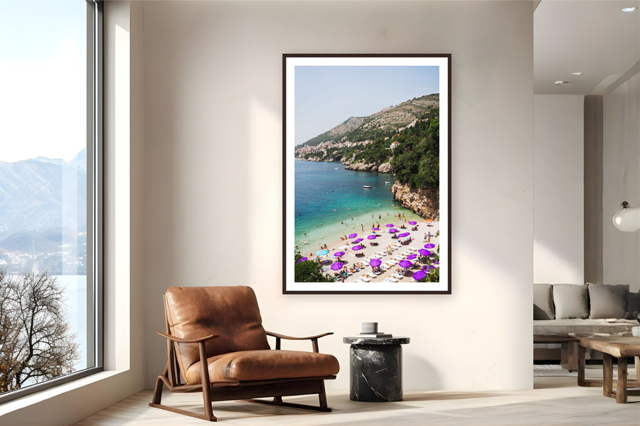 Black wood frame fine art print of Adriatic Summer by Ben Gamlin, Dubrovnik, Croatia, displayed on a reading nook wall — a summer afternoon on the Adriatic, just below Dubrovnik's limestone cliffs.
