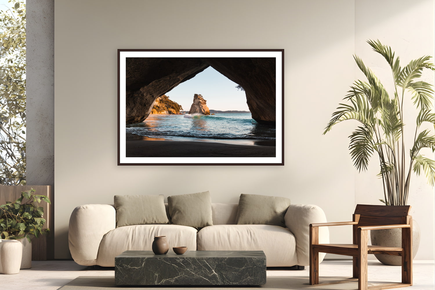 Black wood frame fine art print of The Arch by Ben Gamlin, Cathedral Cove, Coromandel Peninsula, New Zealand, displayed on a modern living room wall — cathedral Cove at first light, framed through its namesake arch.