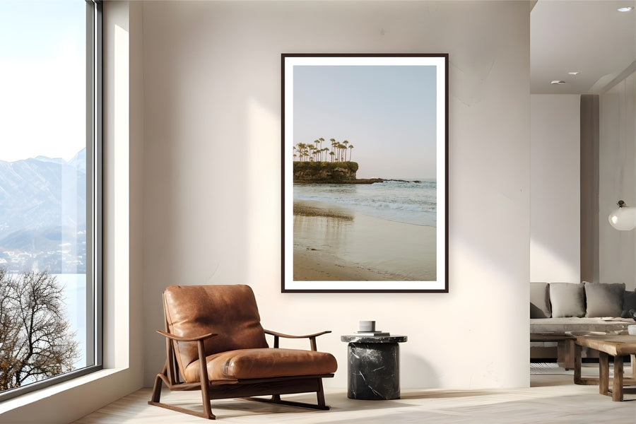 Crescent Bay by Bree Banning from Laguna Beach, CA - framed black frame fine art photography displayed in a reading nook setting