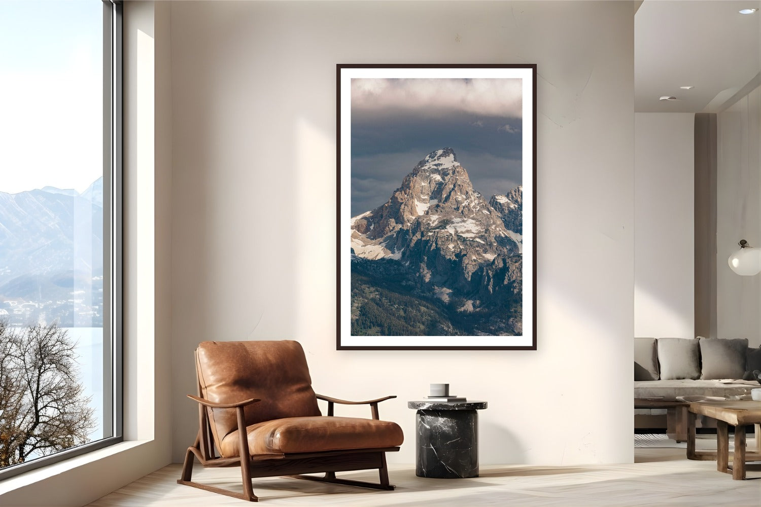 The Grand by Bree Banning from Grand Teton National Park, Wyoming - framed black frame fine art photography displayed in a reading nook setting