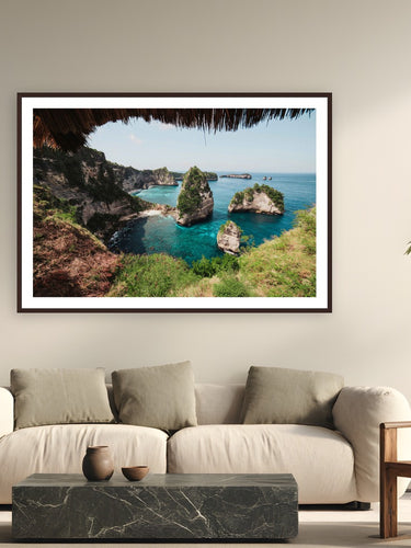 Diamond Beach by Max Dickson from Nusa Penida, Indonesia - framed black frame fine art photography displayed in a modern living room setting