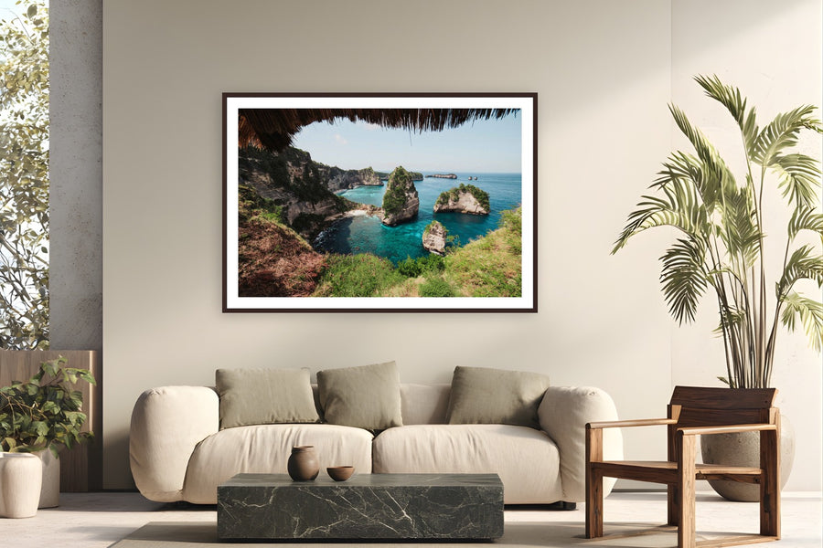 Diamond Beach by Max Dickson from Nusa Penida, Indonesia - framed black frame fine art photography displayed in a modern living room setting