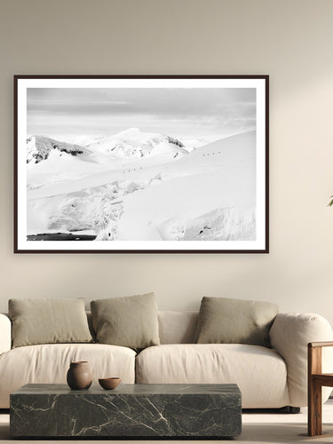 Silent Traverse by Tamara Susa from Antarctica - framed black frame fine art photography displayed in a modern living room setting