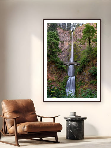 Iconic Multnomah Falls by Tom Ingram from Columbia River Gorge, Oregon - framed black frame fine art photography displayed in a reading nook setting