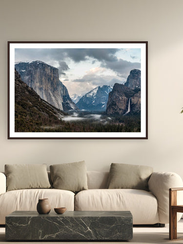 Yosemite's Timeless Gaze by Tom Ingram from Yosemite National Park, California - framed black frame fine art photography displayed in a modern living room setting
